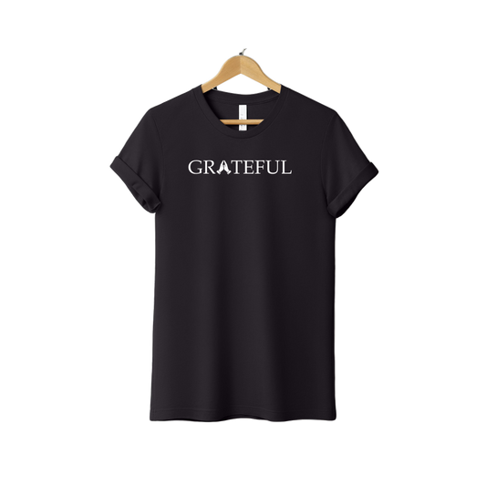 Black Christian T-shirt with white “GRATEFUL” text featuring praying hands in the center, faith-based gratitude tee
