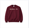 Garnet Just Jesus + Me crewneck sweatshirt with cream lettering across the chest, featuring a classic unisex fit by The Redeemed Brand.
