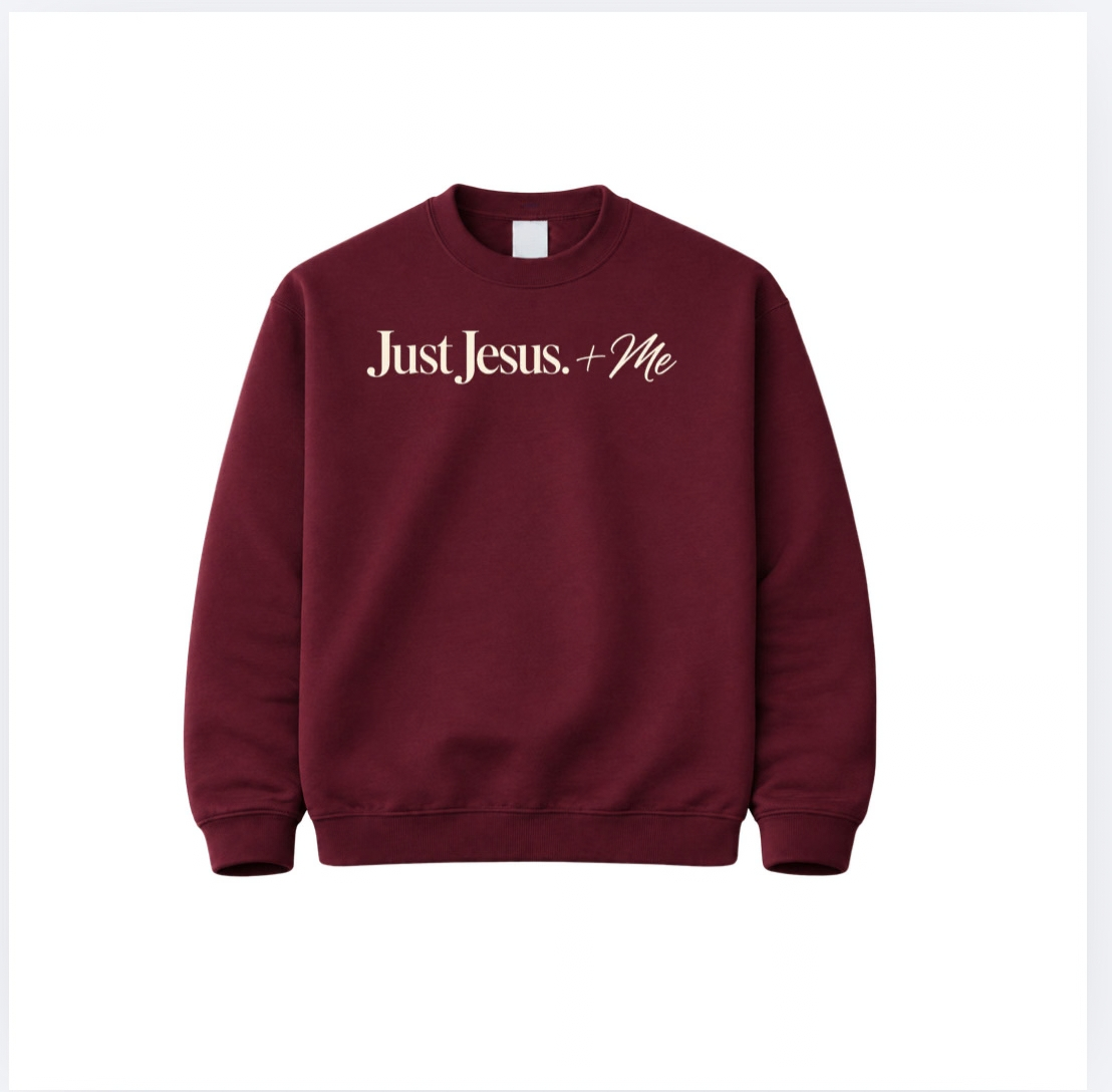 Garnet Just Jesus + Me crewneck sweatshirt with cream lettering across the chest, featuring a classic unisex fit by The Redeemed Brand.